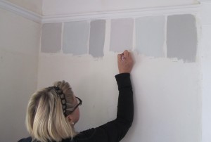 Sharon painting samples.  I think we tried out about 8 lighter grays and 4 darker grays.